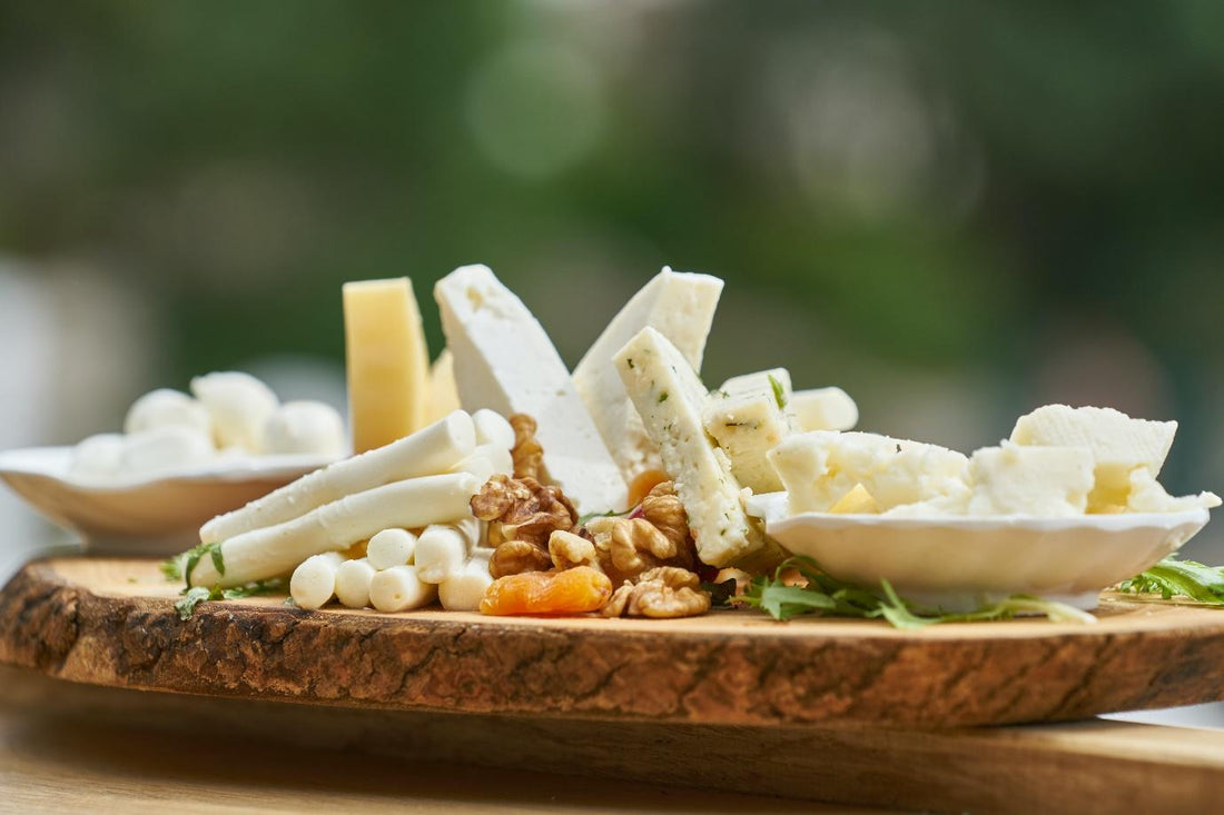 A cheese board with walnuts